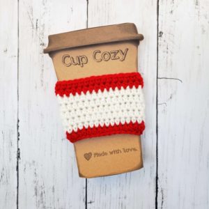 red and white coffee cup cozy