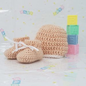 Peach newborn booties and hat set