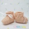 Peach newborn booties