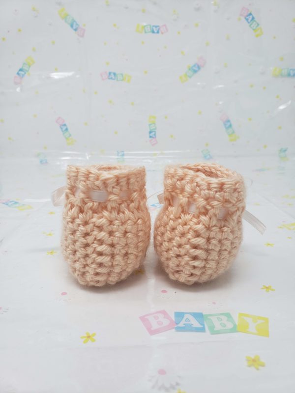 Peach newborn booties