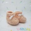 Peach newborn booties