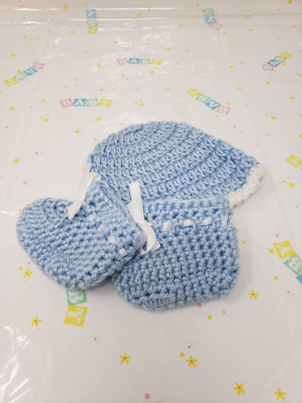 Blue newborn booties and hat set