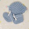 Blue newborn booties and hat set