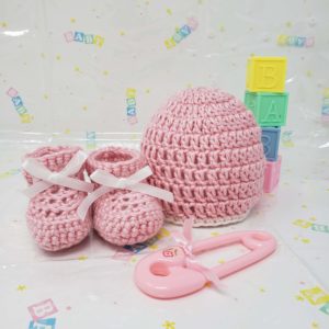 Pink newborn booties and hat set