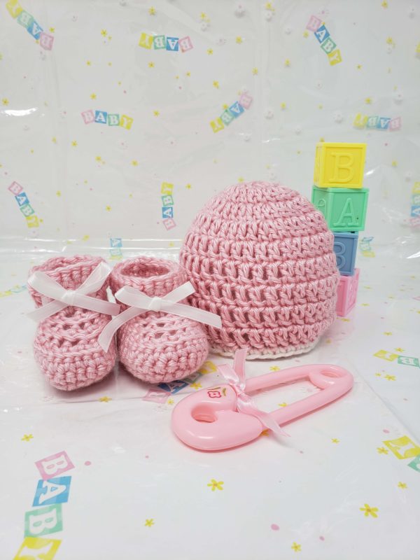 Pink newborn booties and hat set