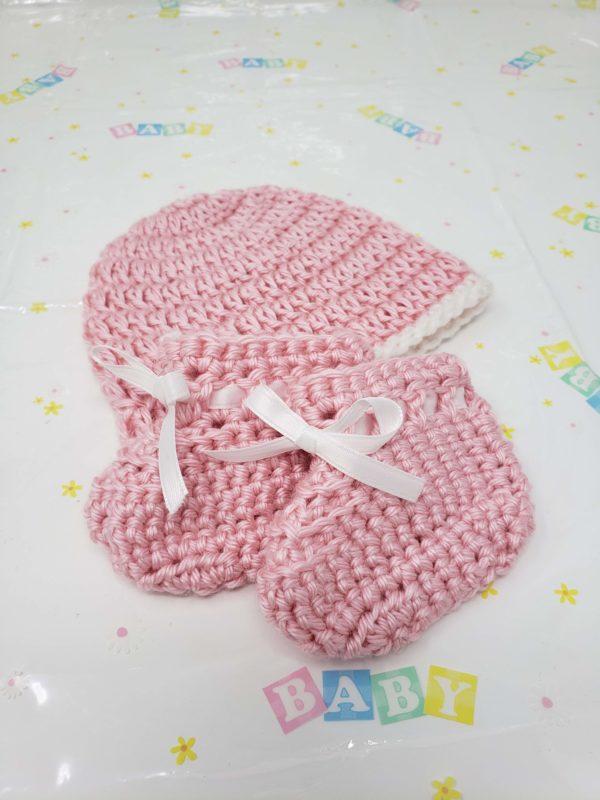 Pink newborn booties and hat set