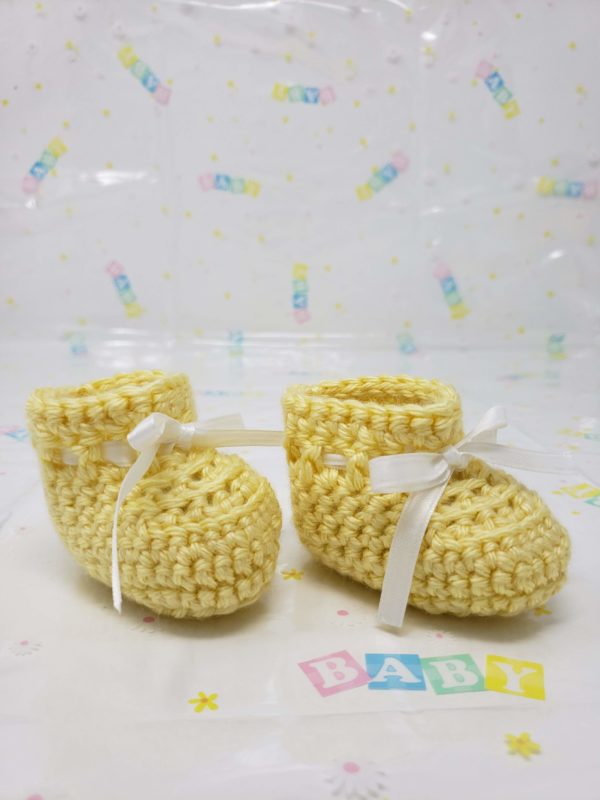 Yellow newborn booties