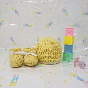 Yellow newborn booties and hat set