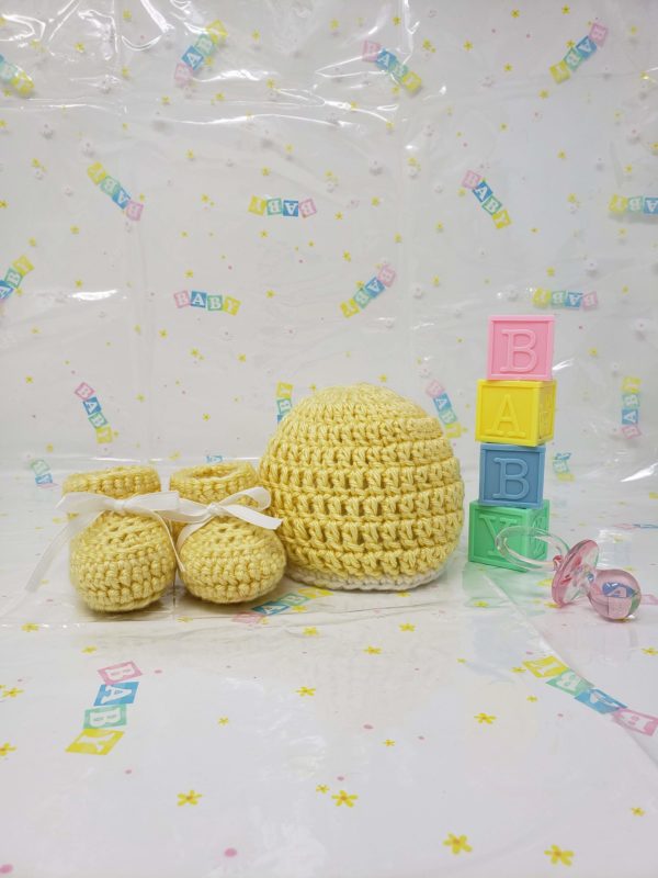 Yellow newborn booties and hat set