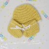 Yellow newborn booties and hat set